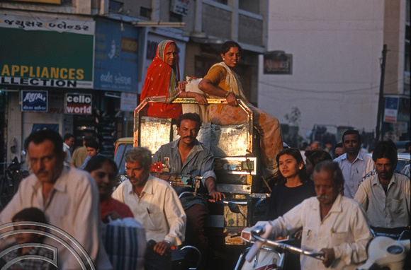 T9640. Women sit atop sacks on a motor rickshaw. Rajkot. Gujarat. India. 11.02.2000