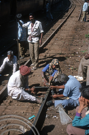 T9657. Cutting metre gauge railway track the hard way. Rajkot. India. 12.02.2000