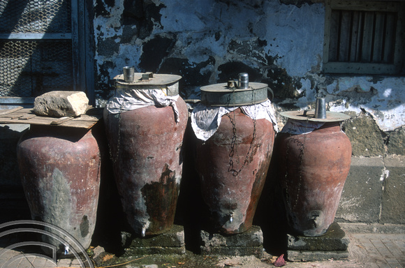 T9665. Urns of drinking water outside a police station. Rajkot. Gujarat. India. 13.02.2000