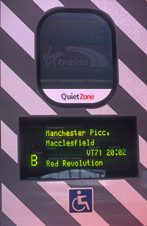 10515. 390006. Red Revolution on a door PIS. London Euston. 30.04.2002.
