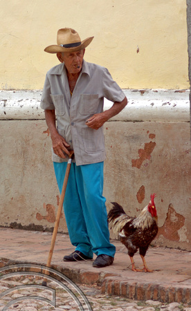 TD01172. Old man & cockerel. Trinidad. Cuba. 05.01.06.