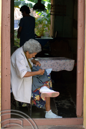 TD01053. Seamstress. Trinidad. Cuba. 31.12.05.