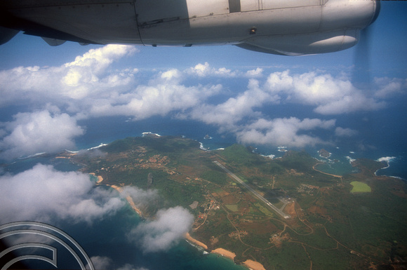 T14158. Flying past the island. Fernando de Noronha. Brazil. 21.8.02