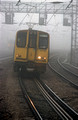 08792. 313052. 11.38 Moorgate - Welwyn GC in fog. Harringay. 01.02.2001