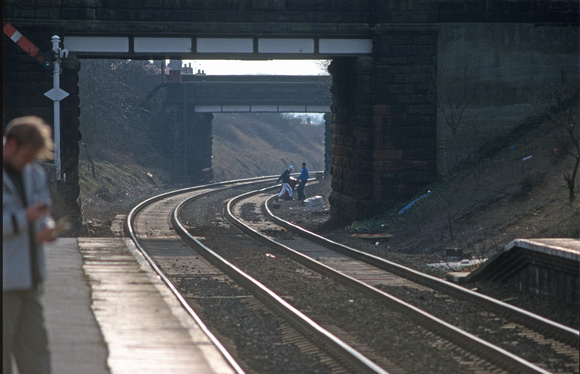 09017. Youths dragging a wheelie bin along the track. Prescot. 08.03.01