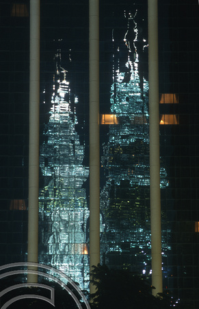 T7430. Reflections of the Petronas Tower at night. Kuala Lumpur. Malaysia. July 1998