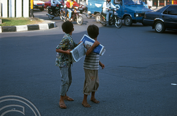 T7477. Kids selling newspapers. Medan. Sumatra. Indonesia. 13th July 1998