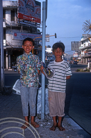 T7479. Kids selling newspapers. Medan. Sumatra. Indonesia. 13th July 1998