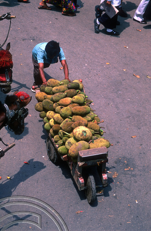 T7581. Hauling Jackfruit in the market. Bukittinggi. West Sumatra. Indonesia. 12th August 1998
