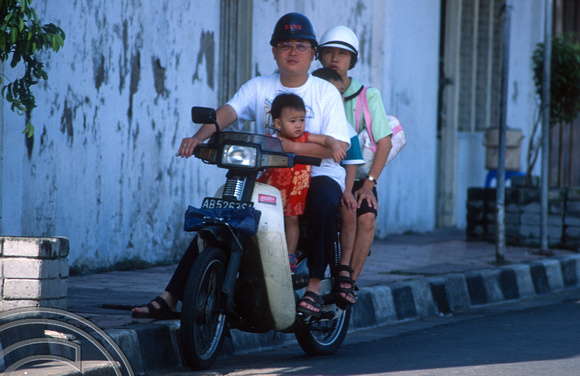T8369. Family on a motorbike. Yogyakarta. Java. Indonesia. December 1998