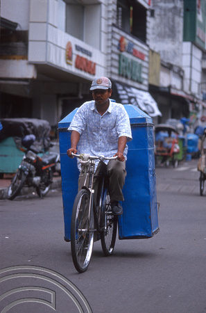 T8345.  Hawker on a bicycle. Yogyakarta. Java. Indonesia. December 1998