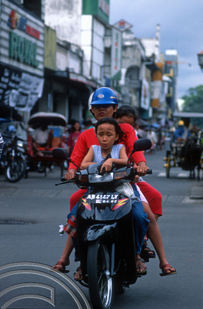 T8352. Family on a Scooter. Yogyakarta. Java. Indonesia. December 1998