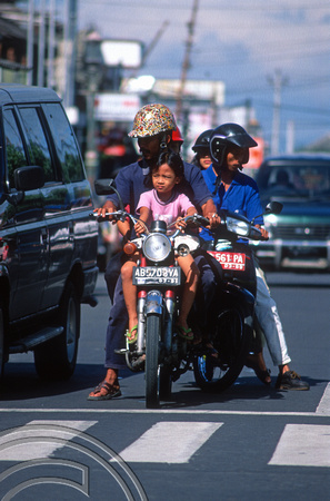 T8371. Family on a motorbike. Yogyakarta. Java. Indonesia. December 1998