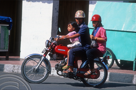 T8372. Family on a motorbike. Yogyakarta. Java. Indonesia. December 1998