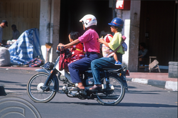 T8373. Family on a motorbike. Yogyakarta. Java. Indonesia. December 1998