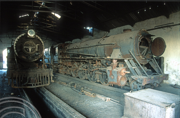 FR0519. YP 4-6-2s No 2825 and YG No 3525. Dumped inside the shed. Wankaner Junction. Gujarat. India. 13.02