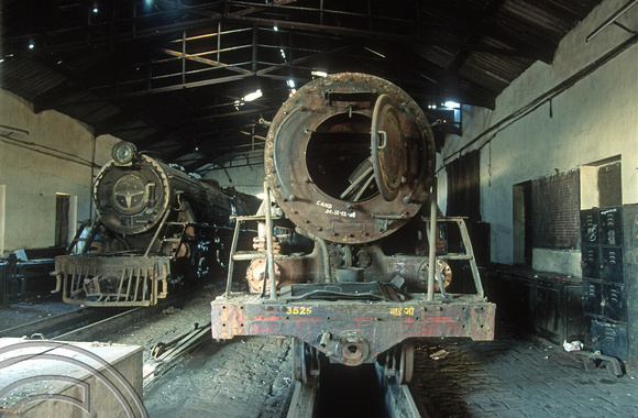 FR0524. YP 4-6-2 No 2825 and YG No 3525. Dumped inside the shed. Wankaner Junction. Gujarat. India. 13.02