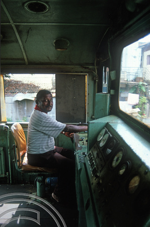 FR0707. M7 No 802. Driver in the cab. Matara. Sri Lanka. 28.12.2002