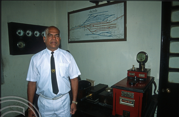 FR0840. Stationmaster Mr Wijesekar with token equipment. Kandy. Sri Lanka. 01.01.2003