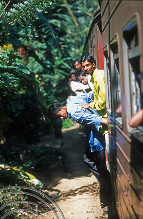 FR0853. Door-hanging on the 10.05 Kandy - Matale. Sri Lanka. 03.01.2003