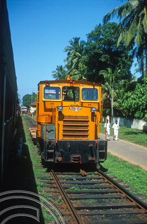 FR0987. Track machine with DMU S835 behind. Kalutura North. Sri Lanka. 14.01.2003