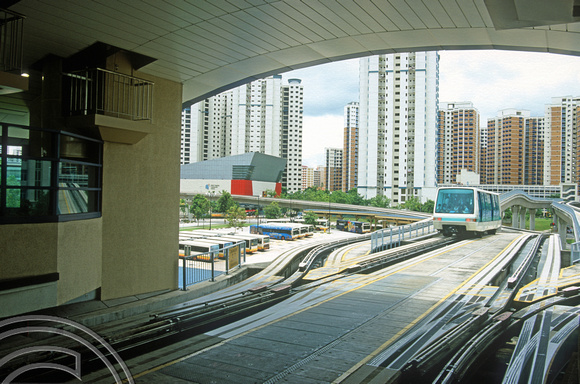 FR1125. Bukit Panjang LRT. Crosses the junction of the loop as it departs the station. Singapore. 09.09.2003