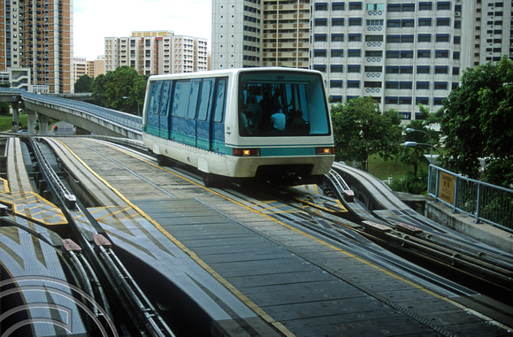 FR1124. Bukit Panjang LRT. LRT 106 crosses the junction of the loop as it arrives at the station. Singapore. 09.09.2003