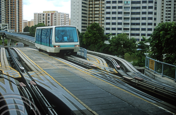 FR1123. Bukit Panjang LRT. An LRT crosses the junction of the loop as it arrives at the station. Singapore. 09.09.2003