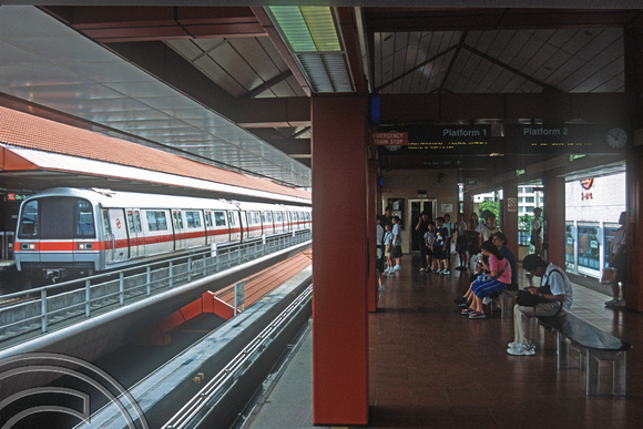 FR1113. MRT trains calls whilst passengers wait for the LRT. Choa Chu Kang MRT. Singapore. 09.09.2003