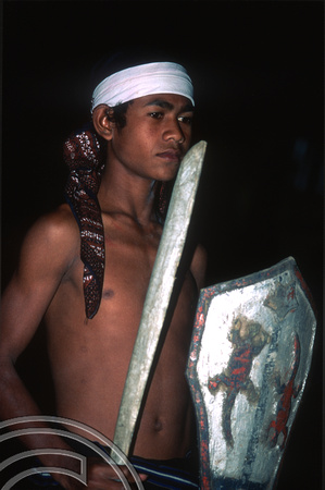 T7809. Man dressed for a dance performance. Moni. Flores. Indonesia. September 1998