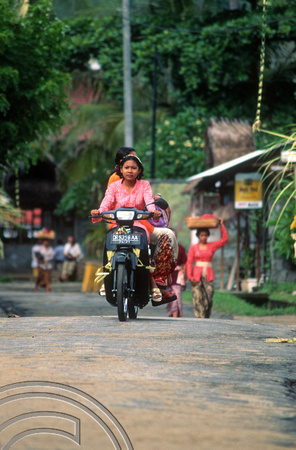 T8142. Girls on their way to the temple. Padangbai. Bali. Indonesia. November 1998