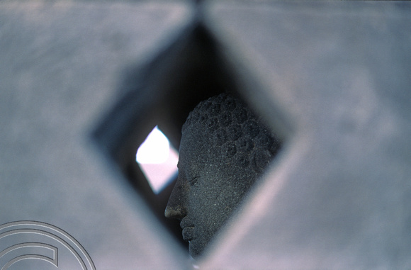 T8258. Buddha in a bell. Borobudur. Java. Indonesia. 25th November 1998