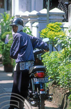 T8310. Girl on a motorcycle. Yogyakarta. Java. Indonesia.  November 1998