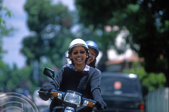 T8294. Girls on a scooter. Prambanan. Java. Indonesia. 19th November 1998