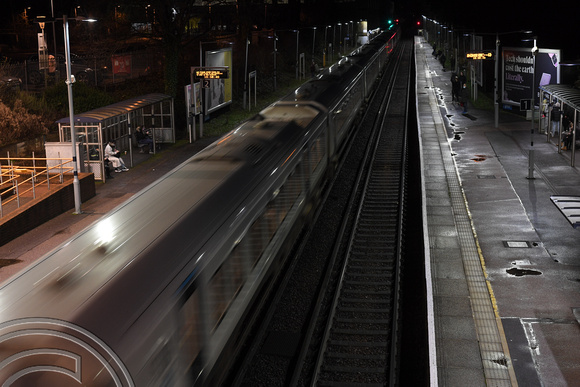 DG364509. Train blur. Effingham Junction. 8.1.2022.