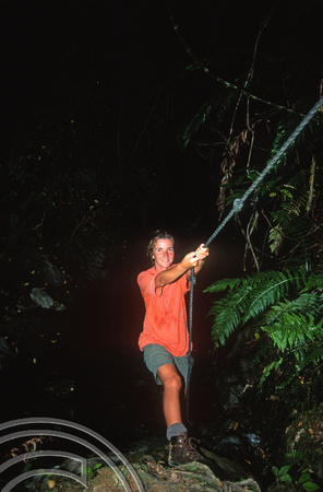 T8775. Lynn as Tarzan. Hopewell backpackers. Kenepuru Sound. Sound. South Island. New Zealand.  8th February 1999