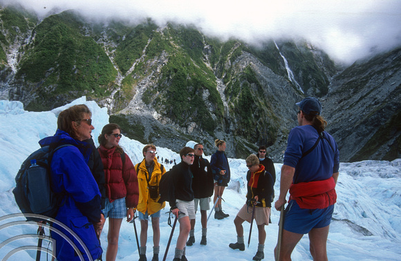 T8919. Our Guide explains. Franz Josef Glacier. South Island. New Zealand. 20th February 1999