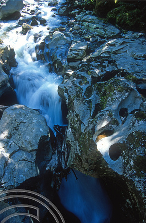 T9028. Waterfall. Milford valley. Fjordland. South Island. New Zealand. 25th February 1999