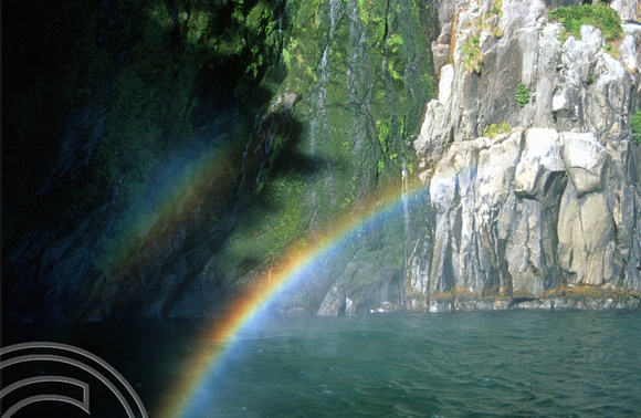 T9030. Waterfall rainbow. Milford Sound. Fjordland. South Island. New Zealand. 25th February 1999