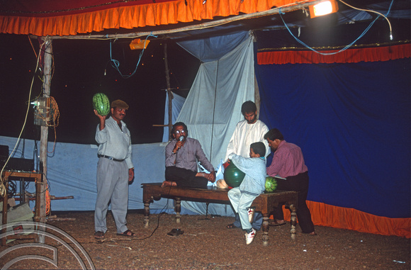 T9270. Auctioning fruit at the temple. Arambol. Goa. India. 21st January 2000