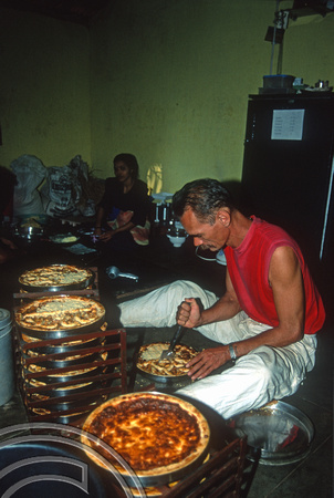 T9301. Axel cutting apple pies. Double Dutch bakery. Arambol. Goa. India. 27th January 2000