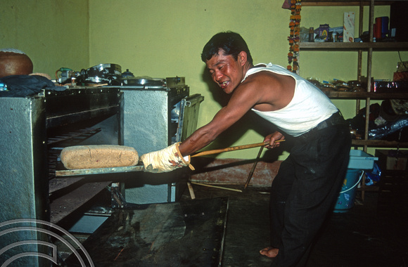 T9307. Krishna baking bread. Double Dutch restaurant. Arambol. Goa. India. 27th January 2000