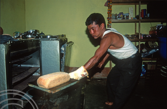 T9308. Krishna baking bread. Double Dutch restaurant. Arambol. Goa. India. 27th January 2000