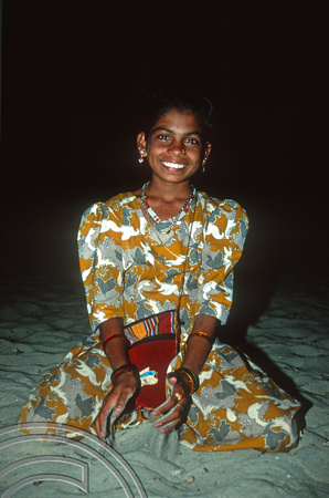 T9312. Tiffi selling clothes on the beach. Arambol. Goa. India. 27th January 2000.