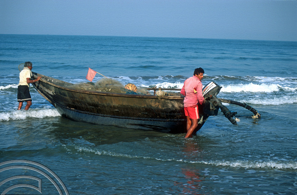 T9370. Fishing boat returns to land. Arambol. Goa. India. 1st February 2000