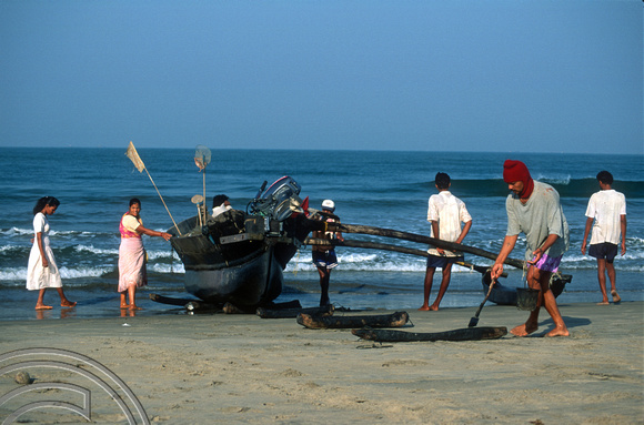 T9371. Fishing boat returns to land. Arambol. Goa. India. 1st February 2000