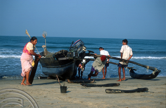 T9373. Fishing boat returns to land. Arambol. Goa. India. 1st February 2000