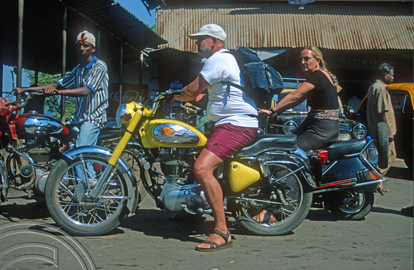 T9413. esterner on a Royal Enfield motorcycle. Siolim. Goa. India. 2nd February 2000
