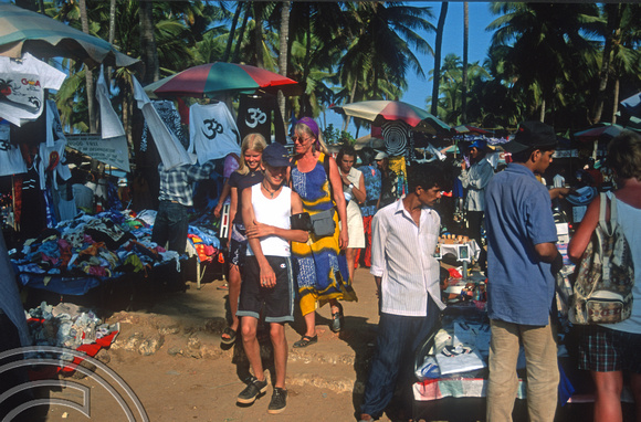 T9420. Family Shopping. Anjuna flea market. Goa. India. 2nd February 2000