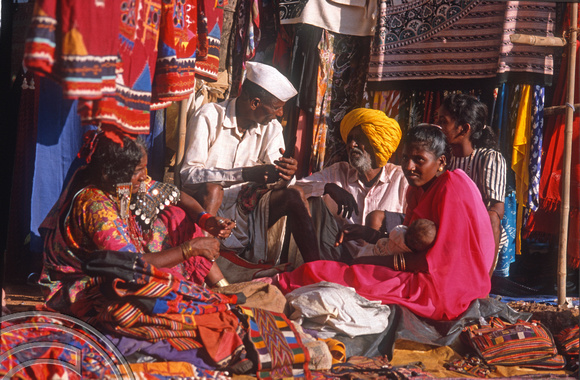 T9437. Family selling bags. Anjuna flea market. Goa. India. 2nd February 2000